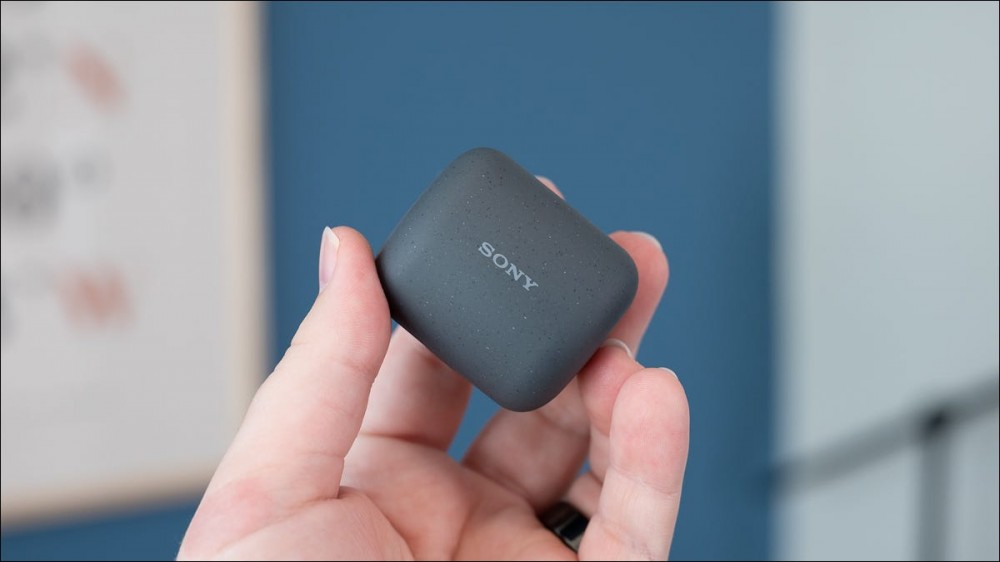 Sony LinkBuds case held in a person's hand.