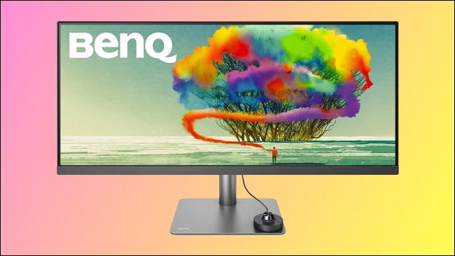 BenQ ultrawide monitor on pink and yellow background