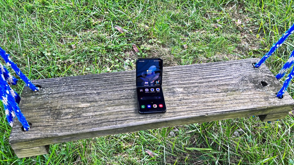 A Galaxy Z Flip 4 on a swing