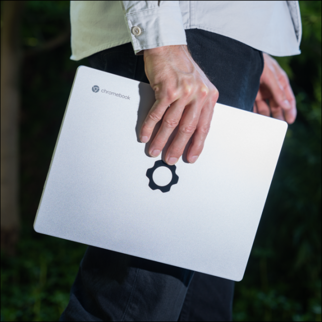 A person holding a Framework Chromebook.