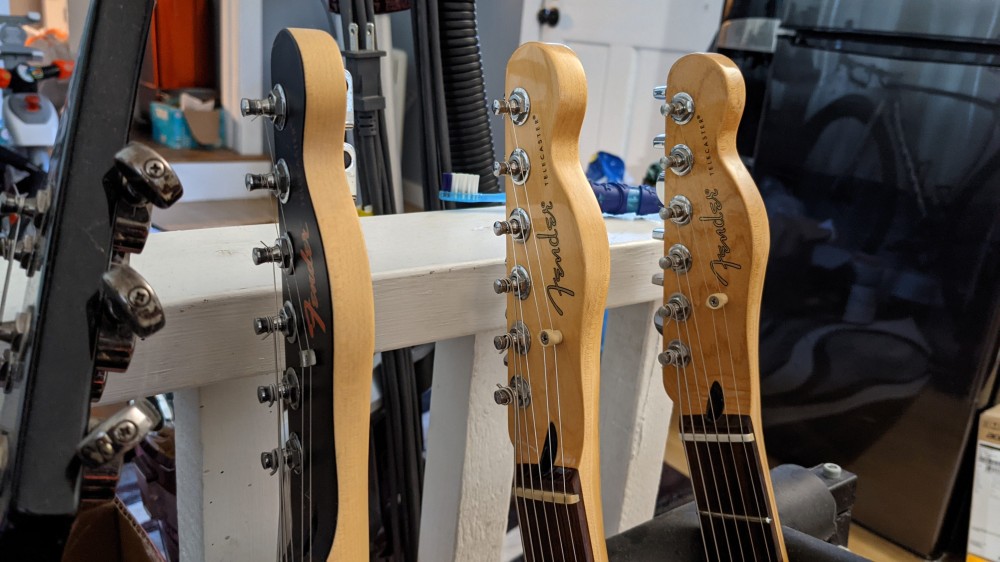 An indoor photo of guitars.